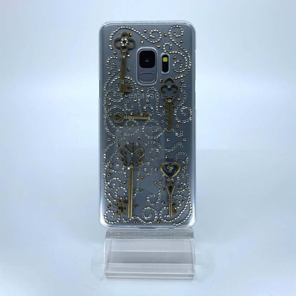 Galaxy S9 PC case. Unique. Handmade. Silver, copper rhinestone swirl design.